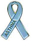A metal pin in the shape of a blue ribbon for asthma awareness.