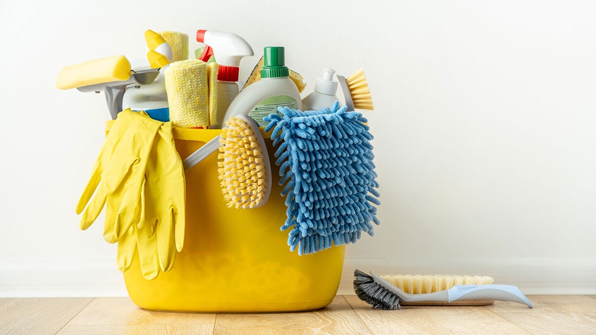 Cleaning supplies in a yellow bucket.