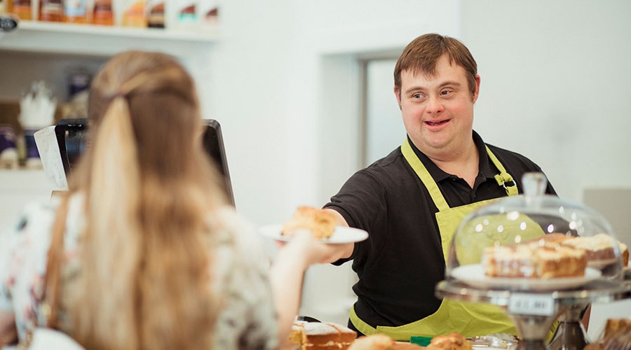 Man with a disability working at a bakery