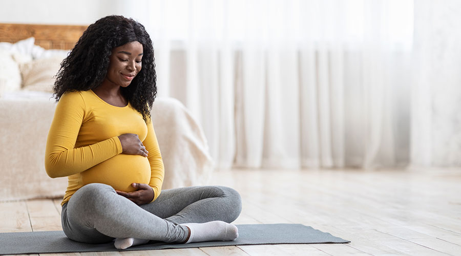 A pregnant mother doing yoga