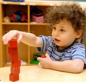 A boy playing with blocks