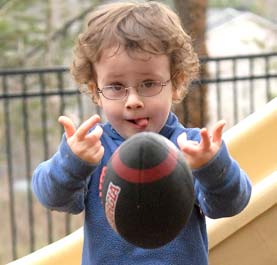 A boy catching a football