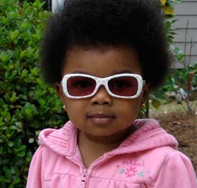 A cute little girl with sunglasses