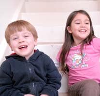 Two children laughing together