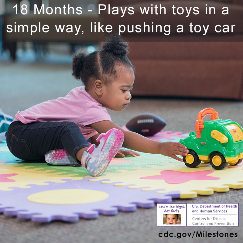 Plays with toys in a simple way, like pushing a toy car