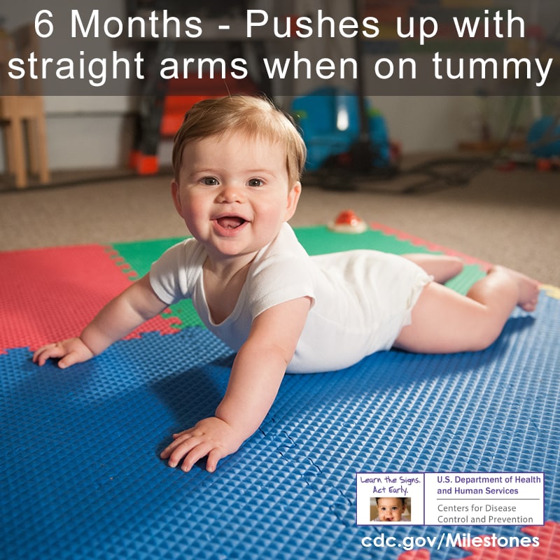 Pushes up with straight arms when on tummy