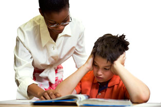 Teacher working with student Teacher working with student