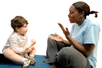 Photo: Teacher using sign language with a child