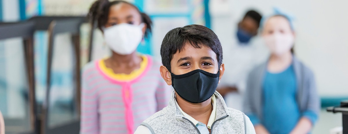 school age children wearing protective masks