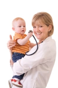 Photo: Physician holding child