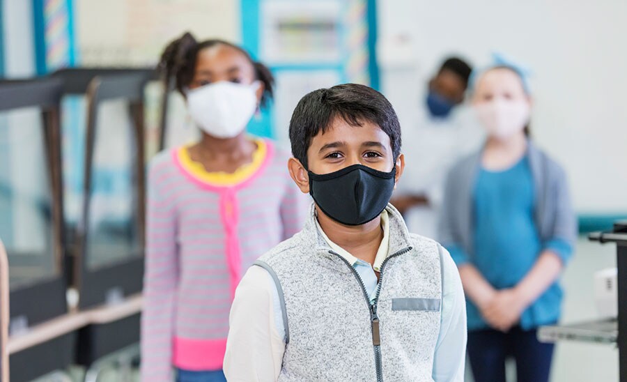 School age children wearing protective face masks