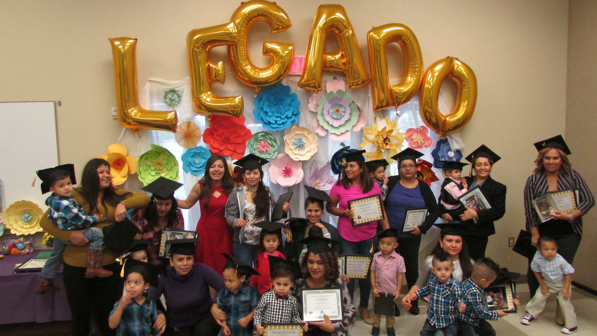 Legacy (Legado) families celebrating graduation.