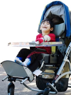 boy in blue wheelchair