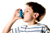 Young boy with inhaler