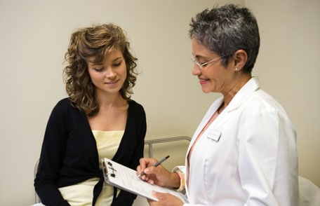Doctor consulting with female patient