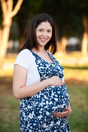 Pregnant woman in a park.