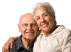 Elderly couple hugging