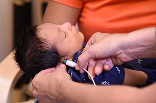 A hearing test on a baby