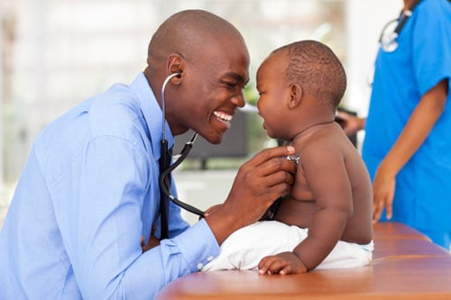 Physician checking child