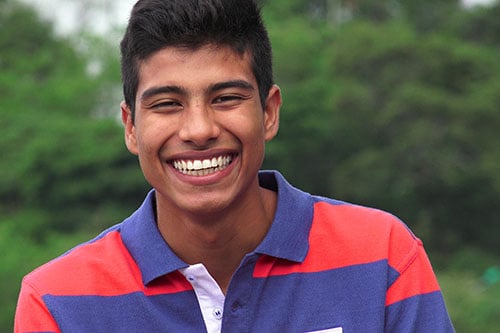 Hispanic Teen Boy Laughing