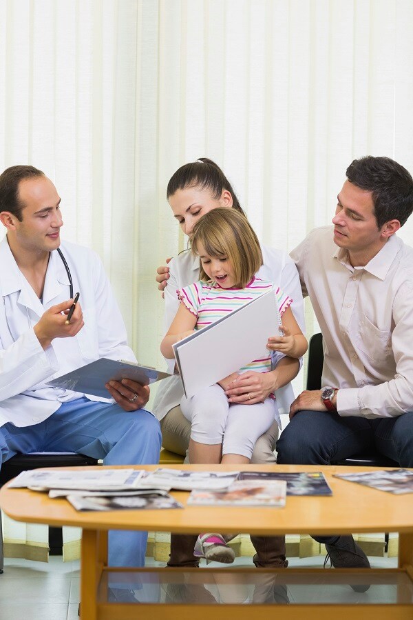 Family receiving medical advice from doctor