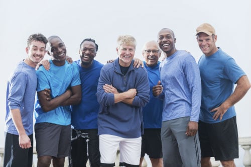 Diverse group of men with blue shirts