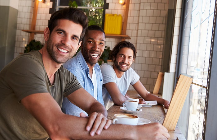 Group of male friends meeting at a coffee shop