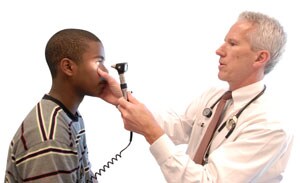 Doctor checking patient's eyes
