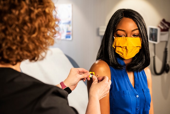 african american woman receiving injection