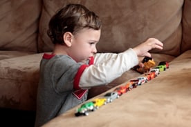 boy playing with cars