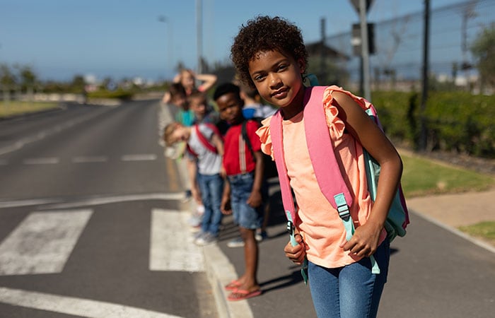 School age children crossing the street to school