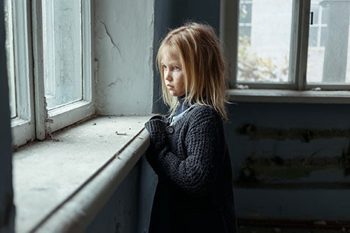 A sad girl at the window