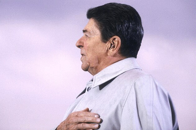 Photo of Ronald Reagan with a hearing aid