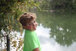 Boy at a riverbank