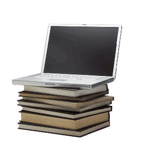 Laptop computer sitting on a stack of books