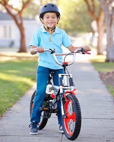Boy sitting on a bike