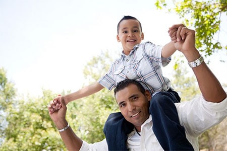 Hispanic Dad Son On Shoulders