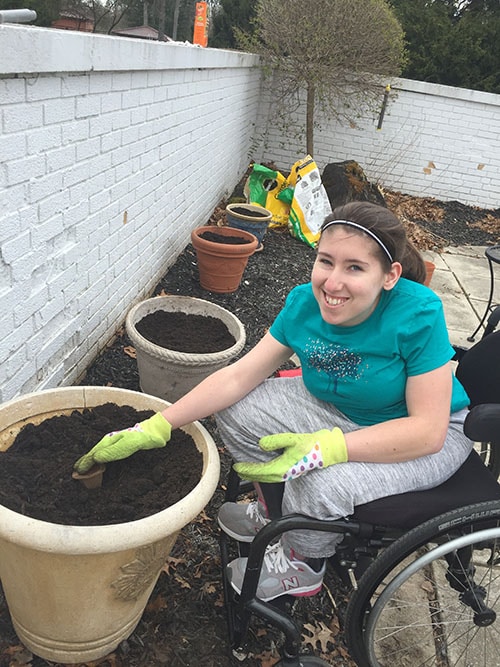 Woman with spina bifida gardening