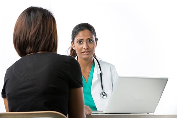A parent discusses their concerns with their child's physician.