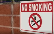 No Smoking sign on a brick building