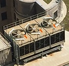 Photo shows arrows pointing to the fan blades on a cooling tower.