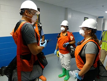Students prepare to conduct an environmental health building assessment following a simulated disaster during the EHTER Operations course.