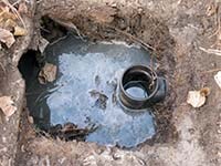 Image of a septic tank inlet.
