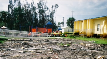Image: Photograph of a flooded area in front of a playground.