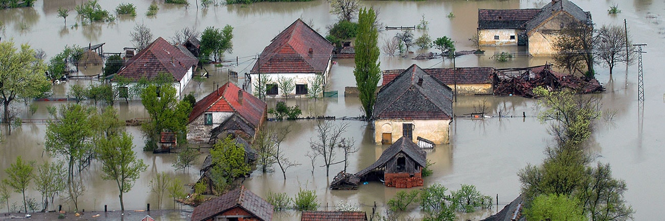 Aerial view of a flooded neighborhood after a natural disaster. 