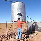 man working on water tank