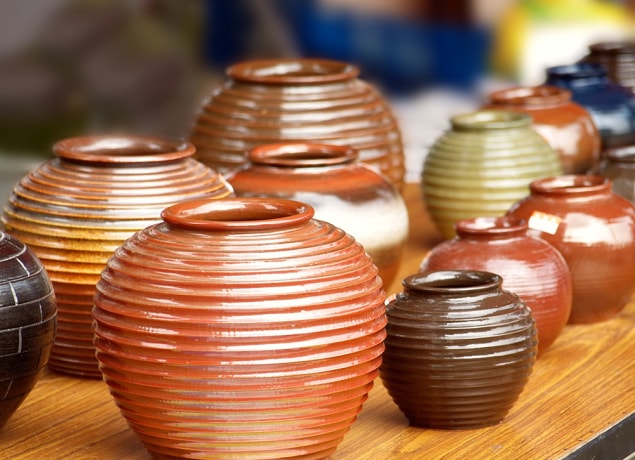 Glazed ceramic pots displayed for sale.
