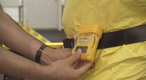 Image of person with alarming dosimeter 