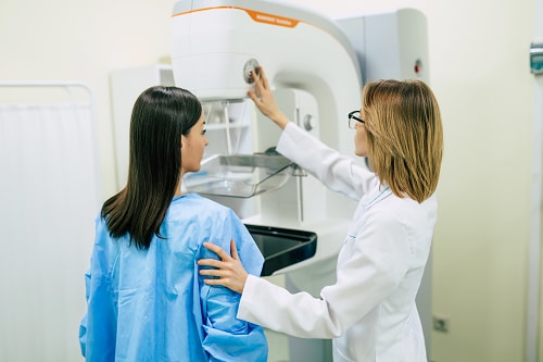 Mammogram being performed on a female patient