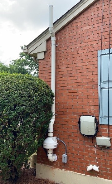 Example of a radon vent pipe system outside of a home